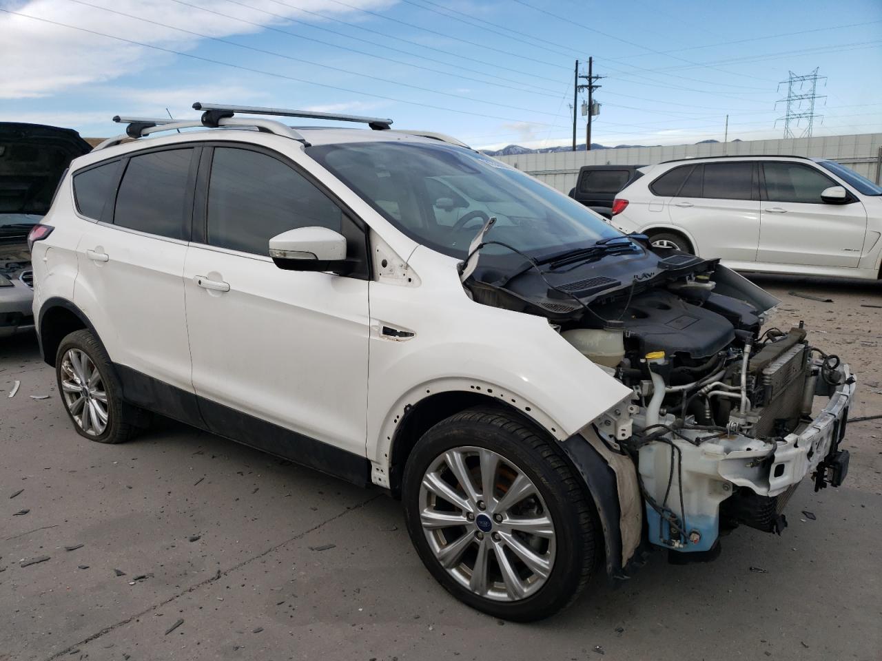 2018 Ford Escape VIN 1FMCU9J95JUC70494 Copart auction photo, front end / hail damage thumbnail 4
