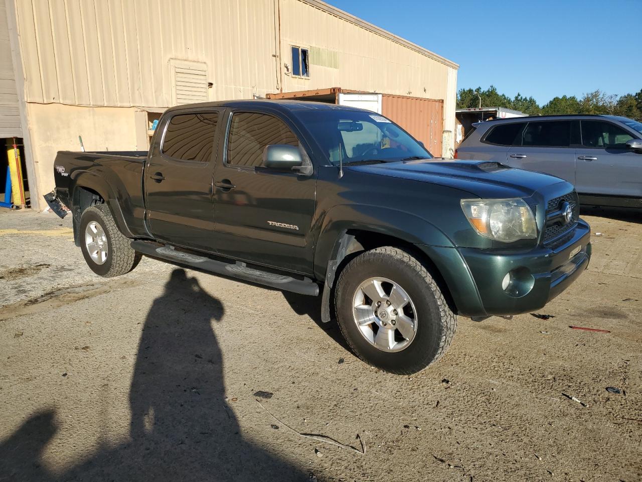 2011 Toyota Tacoma VIN 5TFKU4HN0BX001700 Copart auction photo, rear end damage thumbnail 4