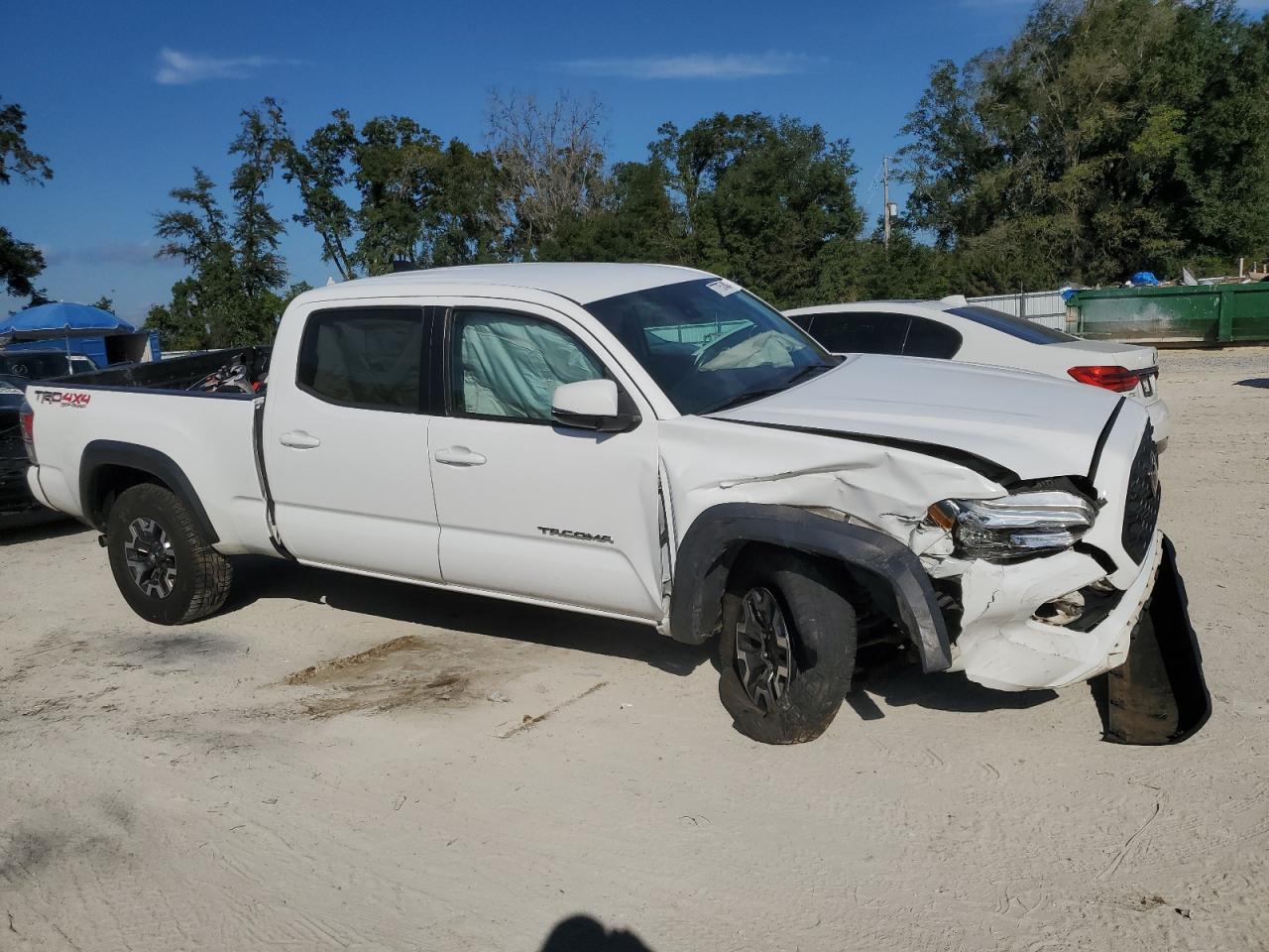 2020 Toyota Tacoma VIN 3TMDZ5BN6LM086199 Copart auction photo, front end / side damage thumbnail 4