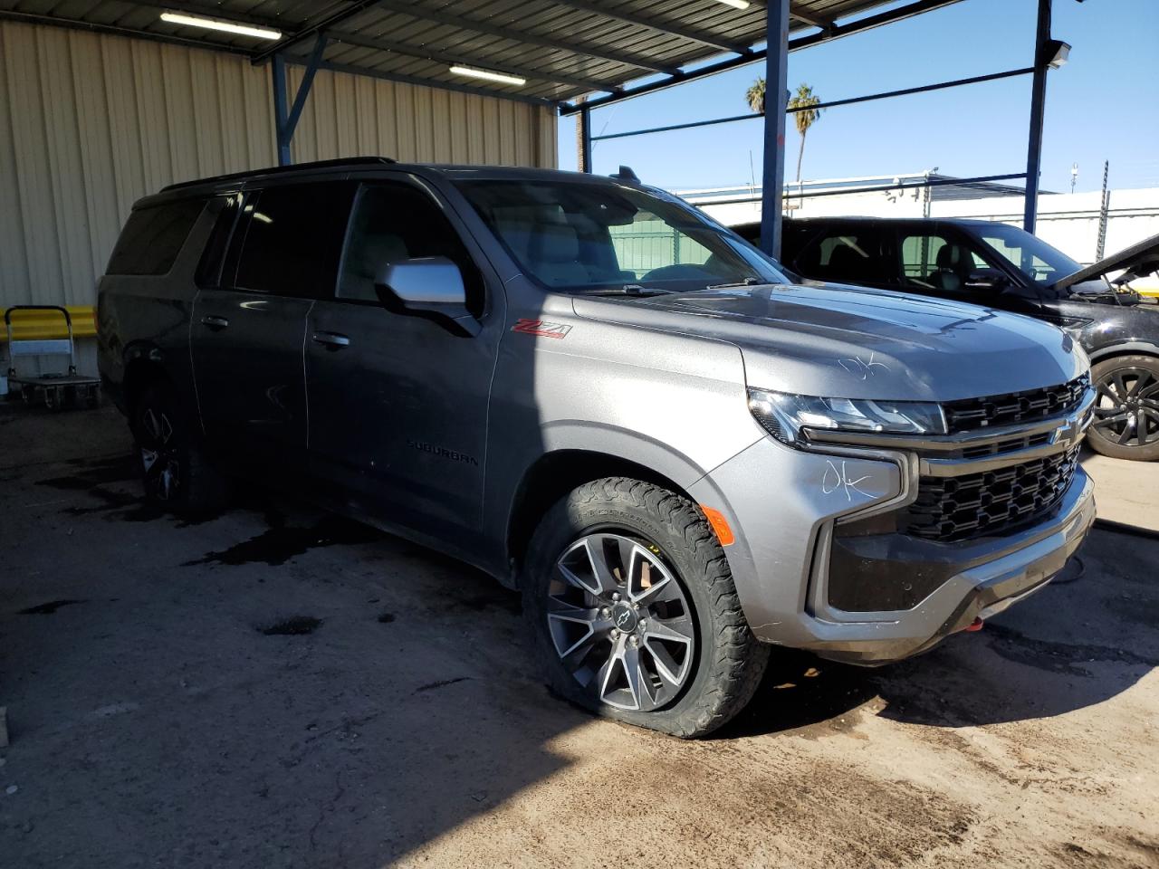 2022 Chevrolet Suburban VIN 1GNSKDKDXNR255145 Copart auction photo, all over damage thumbnail 4