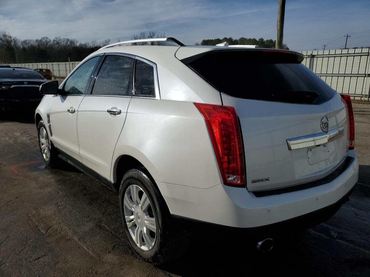 2012 Cadillac SRX VIN 3GYFNAE30CS599476 Copart auction photo, rear end damage thumbnail 2