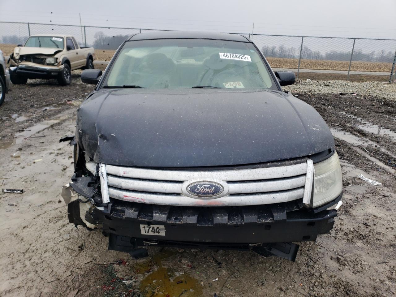 2009 Ford Taurus VIN 1FAHP23WX9G110767 Copart auction photo, front end / all over damage thumbnail 5
