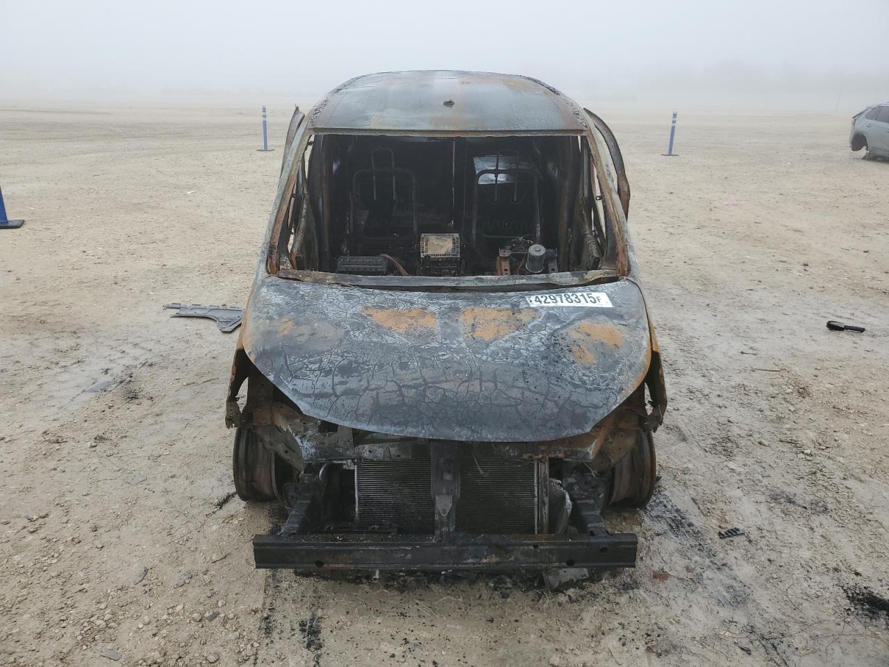 2014 Nissan NV VIN 3N6CM0KN6EK698539 Copart auction photo, burn damage thumbnail 5