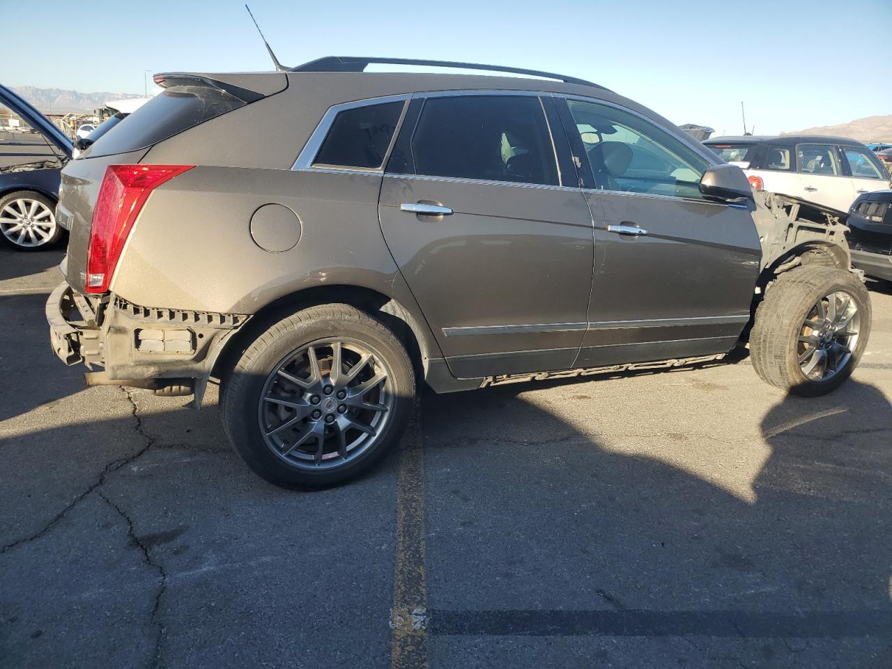 2014 Cadillac SRX VIN 3GYFNAE34ES561414 Copart auction photo, undercarriage damage thumbnail 3