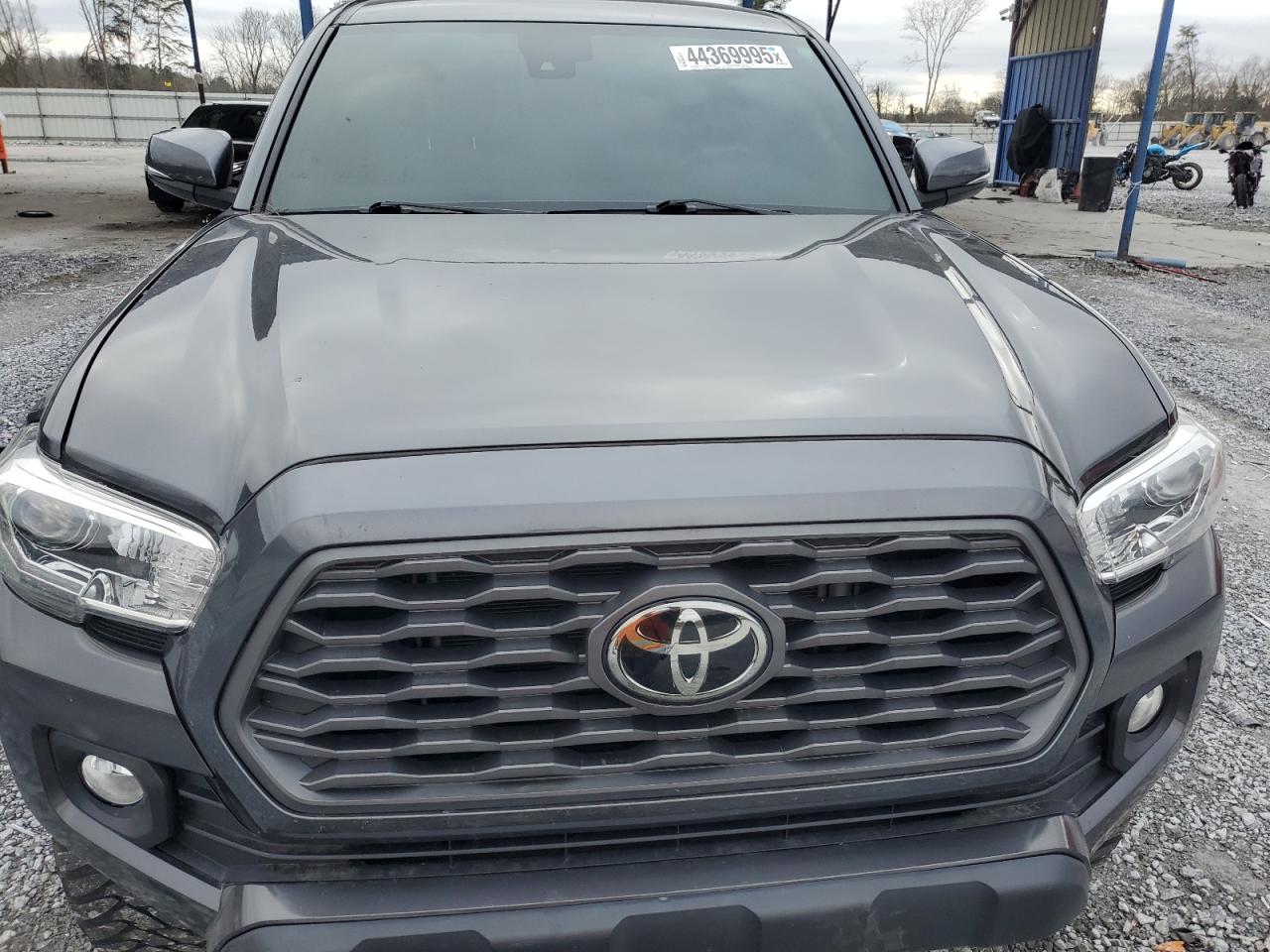 2021 Toyota Tacoma VIN 3TMCZ5AN9MM443907 Copart auction photo, side damage thumbnail 12