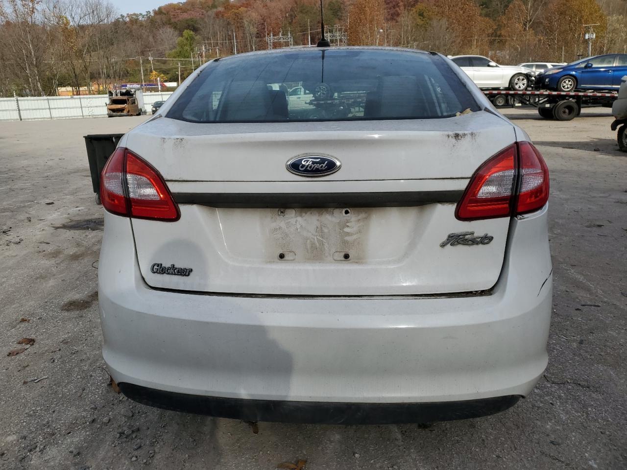 2012 Ford Fiesta VIN 3FADP4AJ6CM106830 Copart auction photo, side / rear end damage thumbnail 6