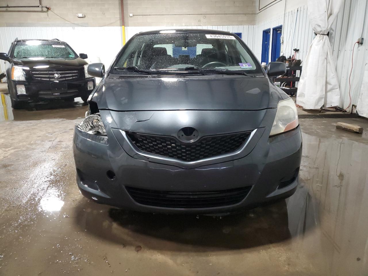 2009 Toyota Yaris VIN JTDBT903094042849 Copart auction photo, side / front end damage thumbnail 5