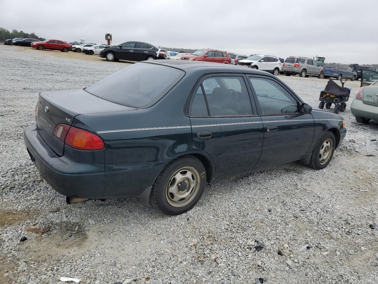 1999 Toyota Corolla VIN 1NXBR12E4XZ301916 Copart auction photo, side damage thumbnail 3