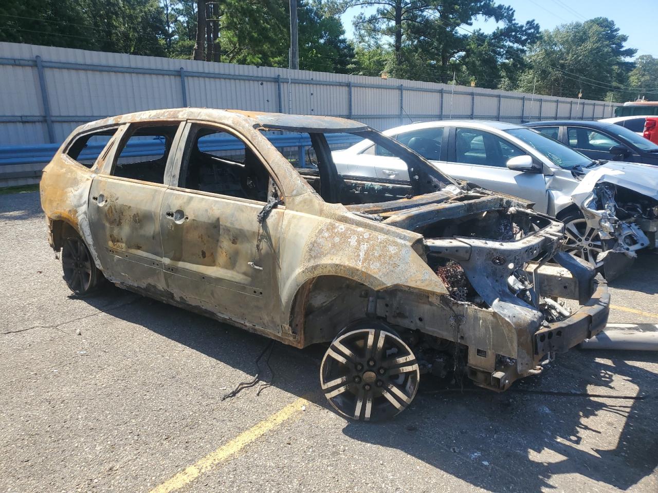 2013 Chevrolet Traverse VIN 1GNKRGKD1DJ130724 Copart auction photo, burn damage thumbnail 4