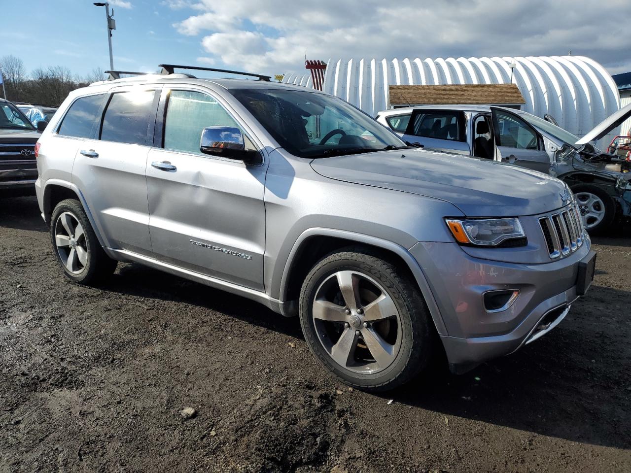 2016 Jeep Grand Cherokee VIN 1C4RJFCG9GC364409 Copart auction photo, side / minor dent/scratches damage thumbnail 4