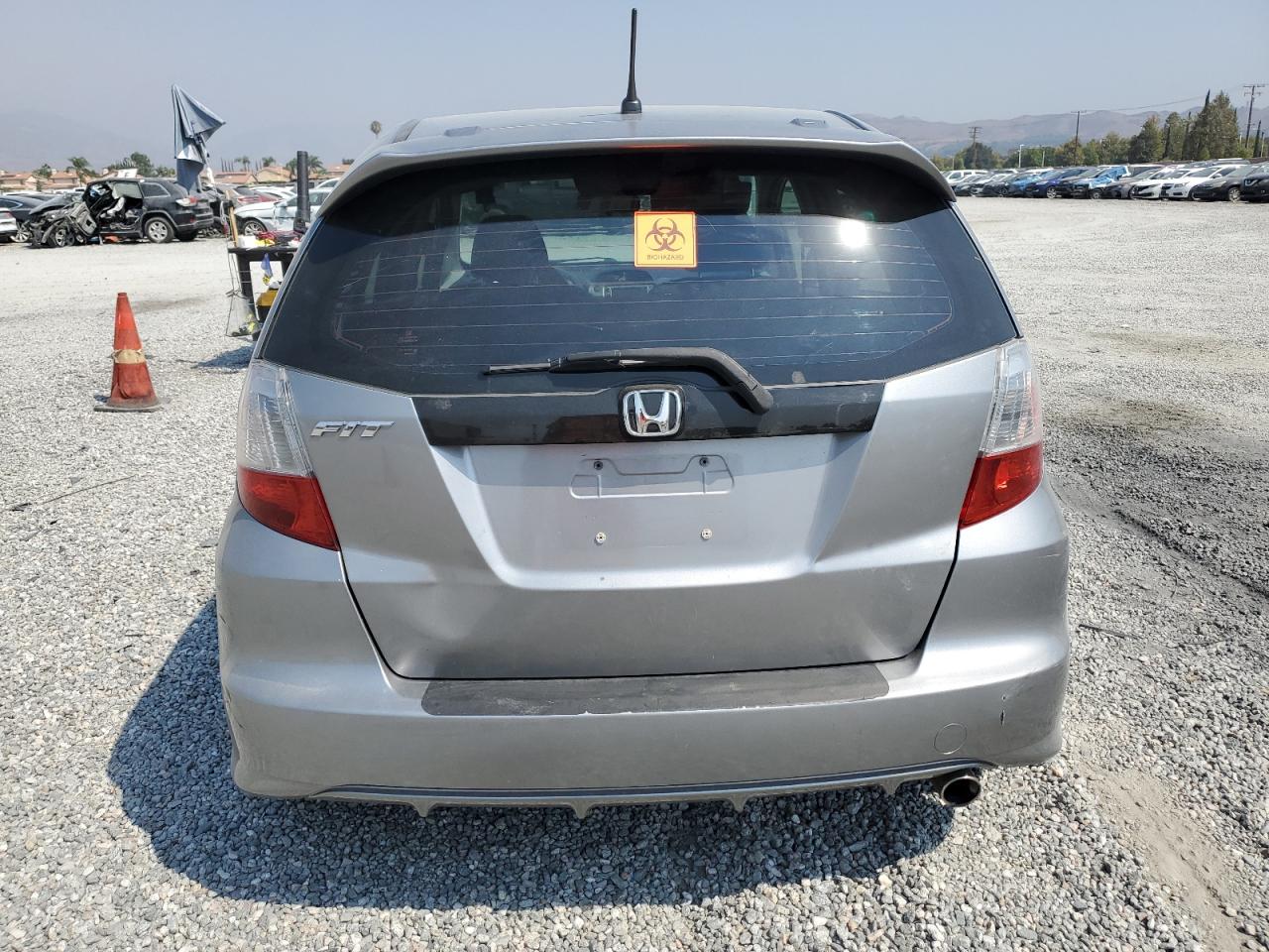 2010 Honda Fit VIN JHMGE8H64AS012521 Copart auction photo, side / front end damage thumbnail 6