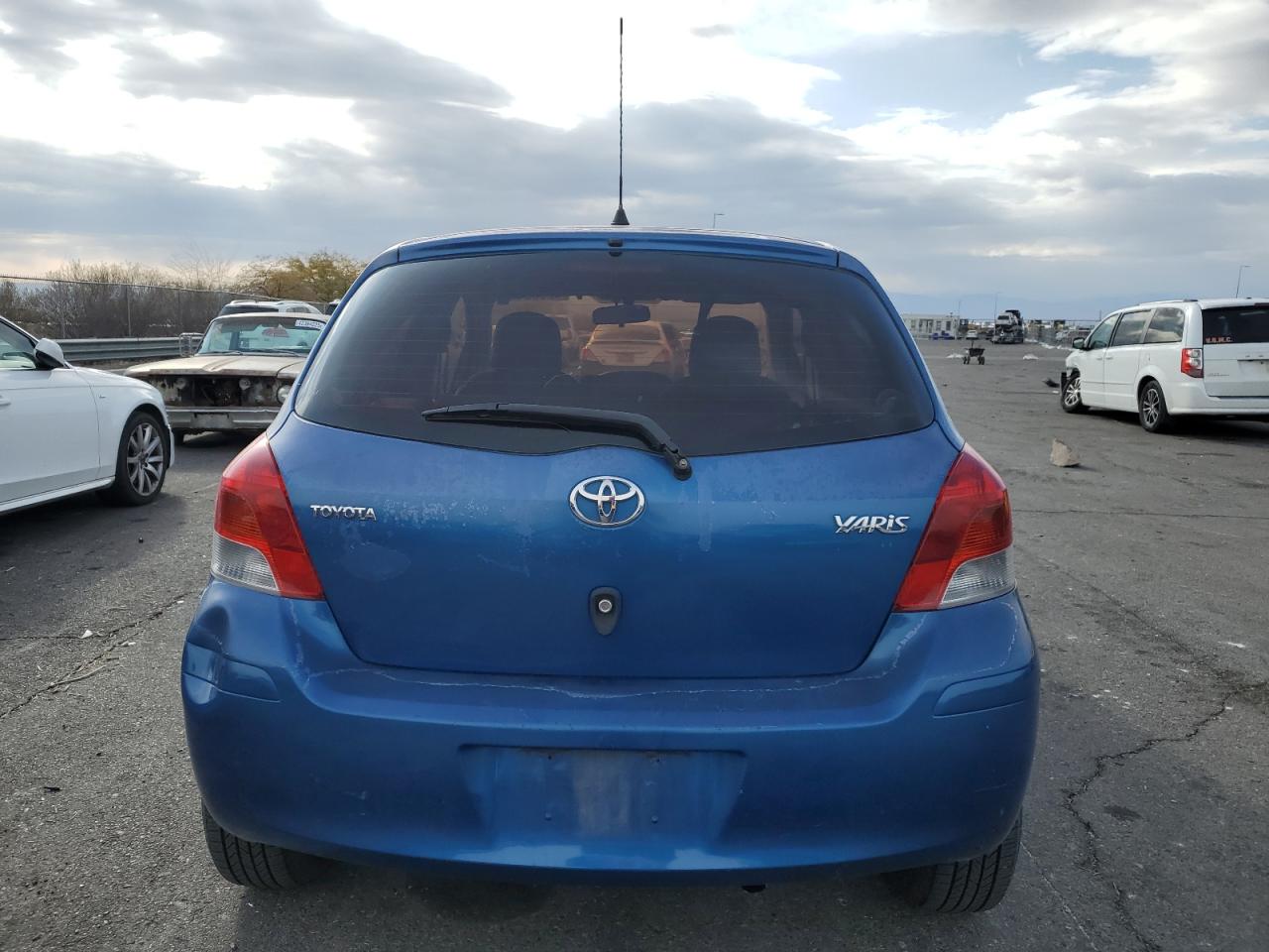 2011 Toyota Yaris VIN JTDKT4K38B5335821 Copart auction photo, front end damage thumbnail 6