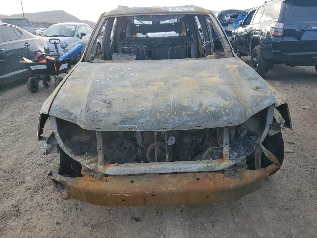 2005 GMC Envoy VIN 1GKES12S956196761 Copart auction photo, burn damage thumbnail 5