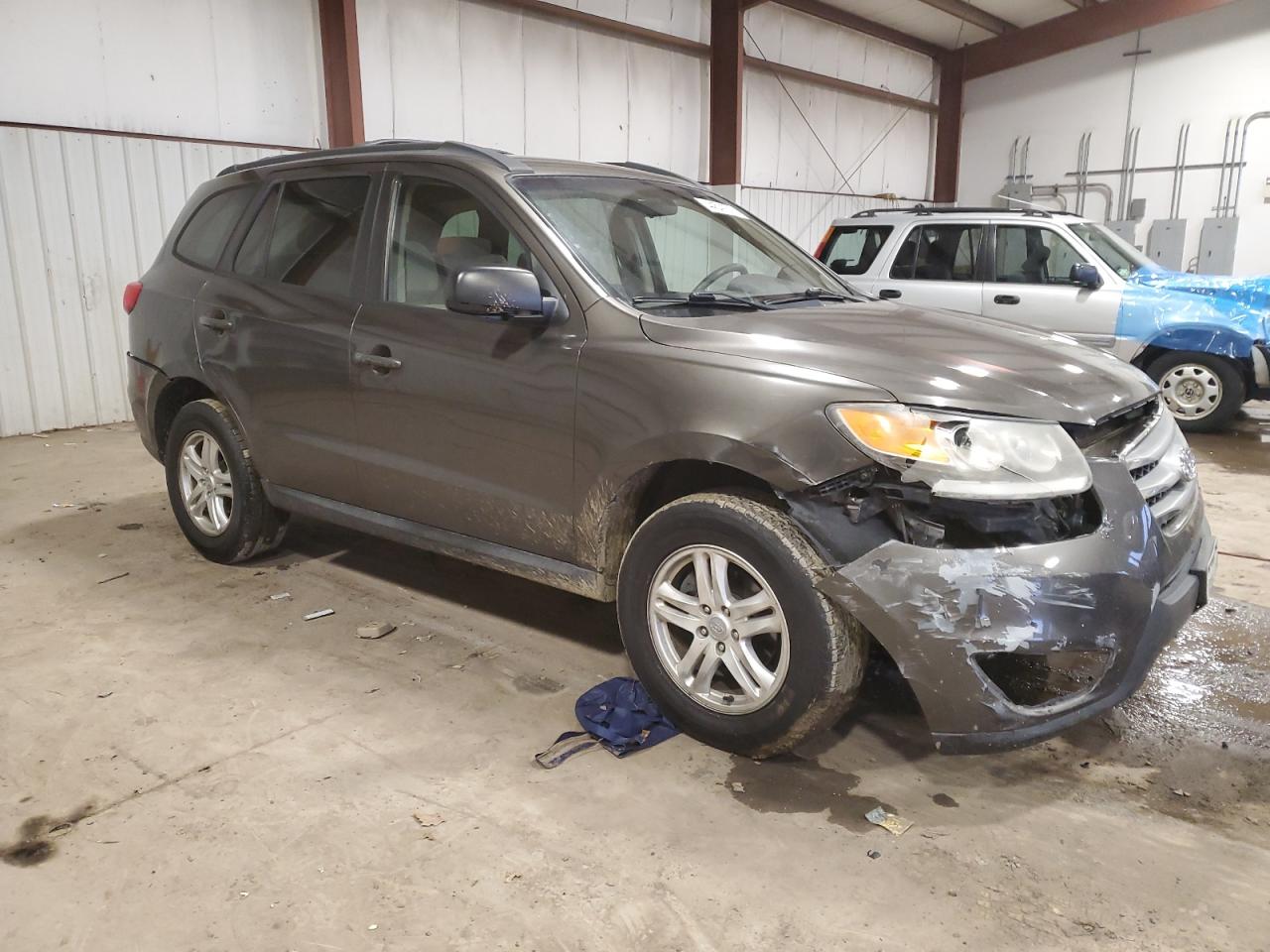 2012 Hyundai Santa Fe VIN 5XYZGDAB6CG124606 Copart auction photo, front end / rear end damage thumbnail 4