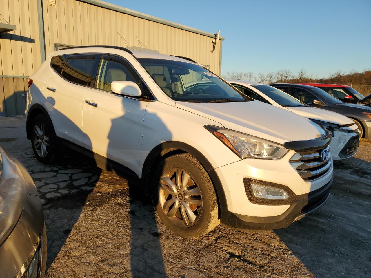 2013 Hyundai Santa Fe VIN 5XYZUDLA9DG060253 Copart auction photo, normal wear / minor dent/scratches damage thumbnail 4