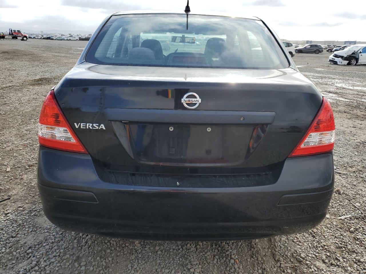 2010 Nissan Versa VIN 3N1CC1AP2AL411462 Copart auction photo, front end / minor dent/scratches damage thumbnail 6