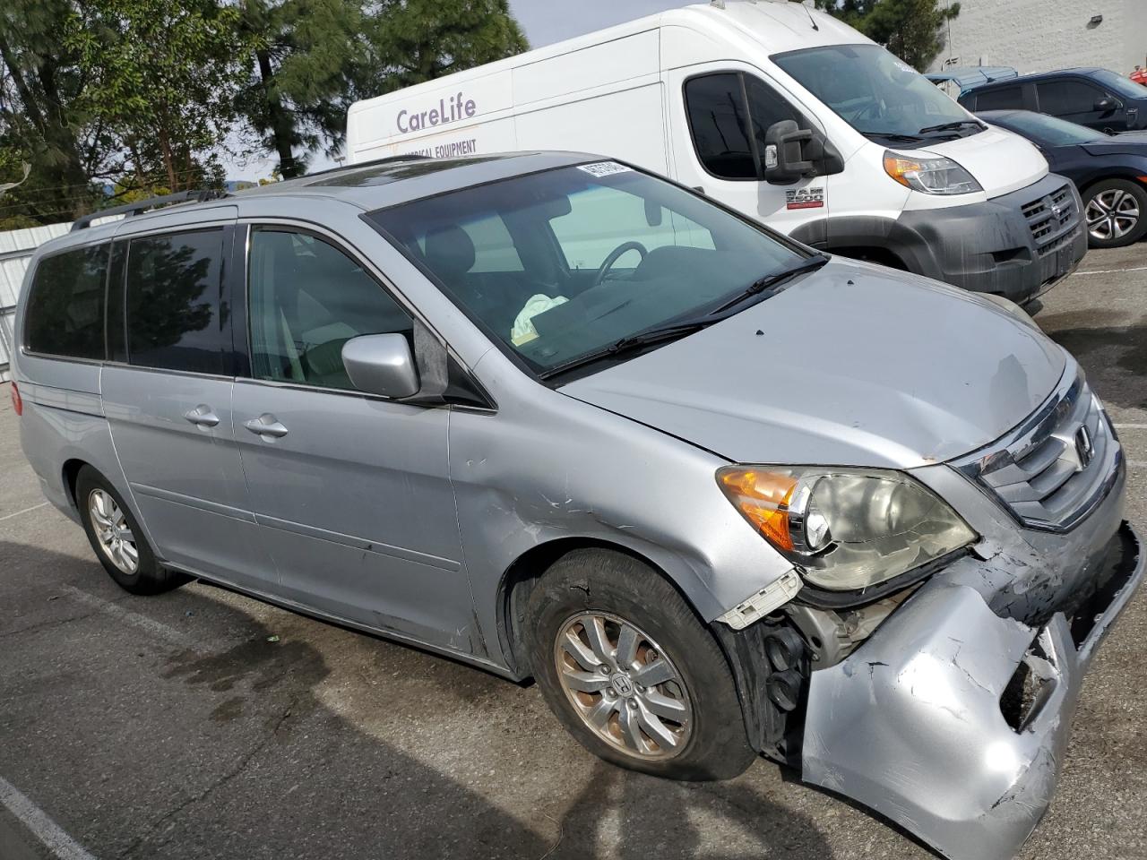 2010 Honda Odyssey VIN 5FNRL3H60AB026139 Copart auction photo, front end damage thumbnail 4