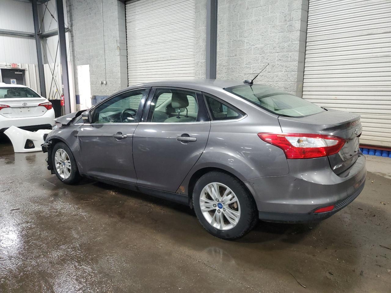 2012 Ford Focus VIN 1FAHP3H20CL197542 Copart auction photo, front end / side damage thumbnail 2