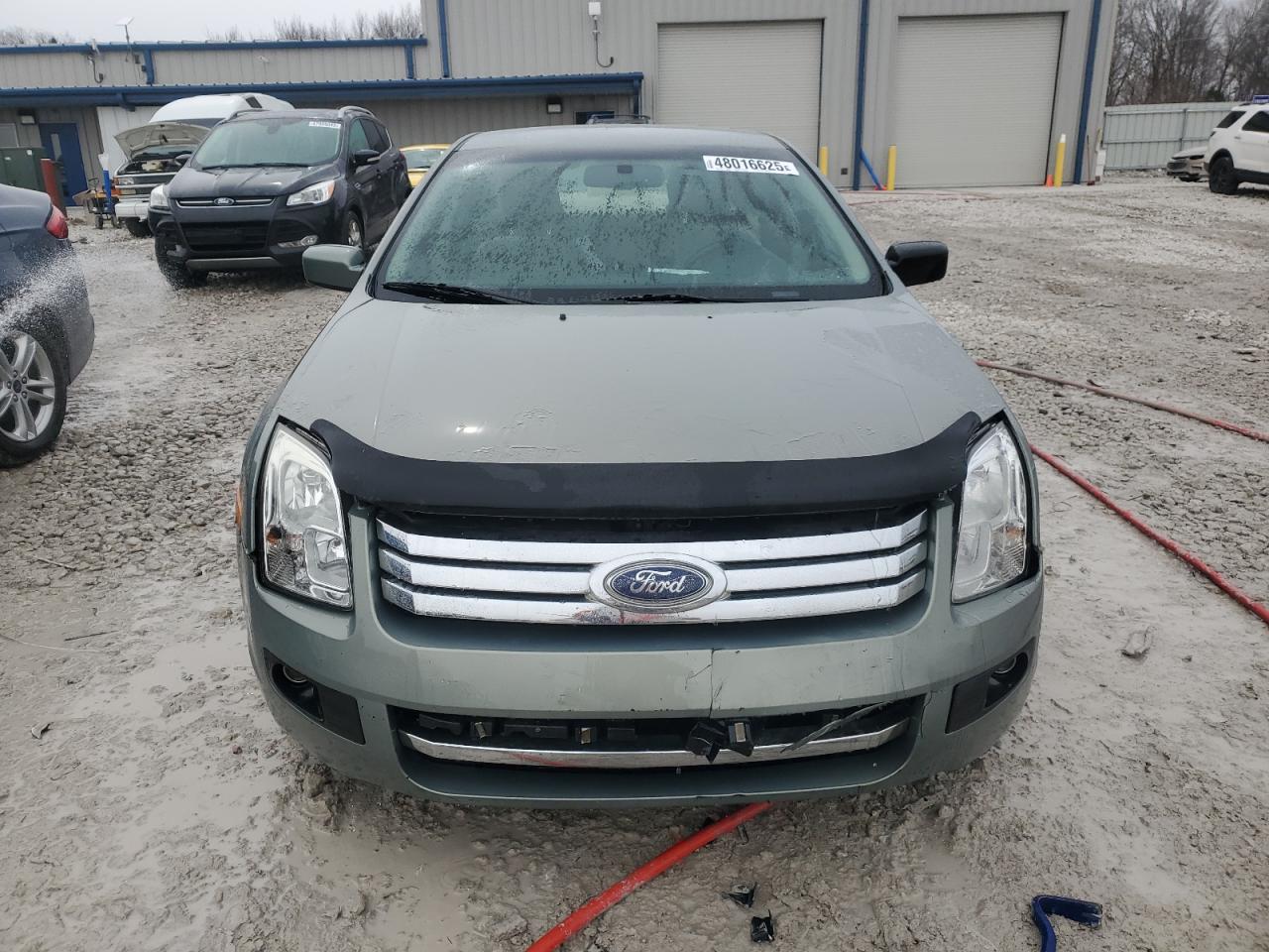 2009 Ford Fusion VIN 3FAHP08Z99R142108 Copart auction photo, vandalism damage thumbnail 5
