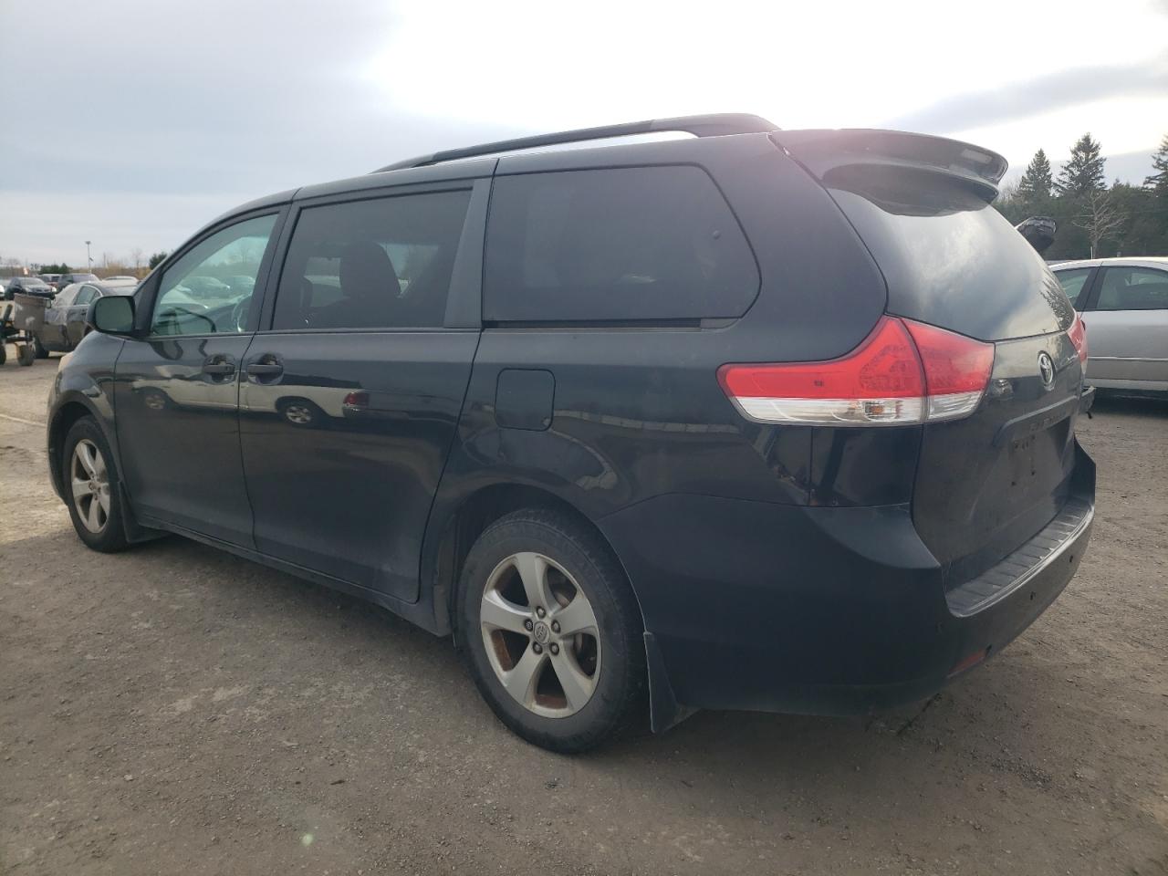 2012 Toyota Sienna VIN 5TDZK3DC6CS245104 Copart auction photo, side / front end damage thumbnail 2
