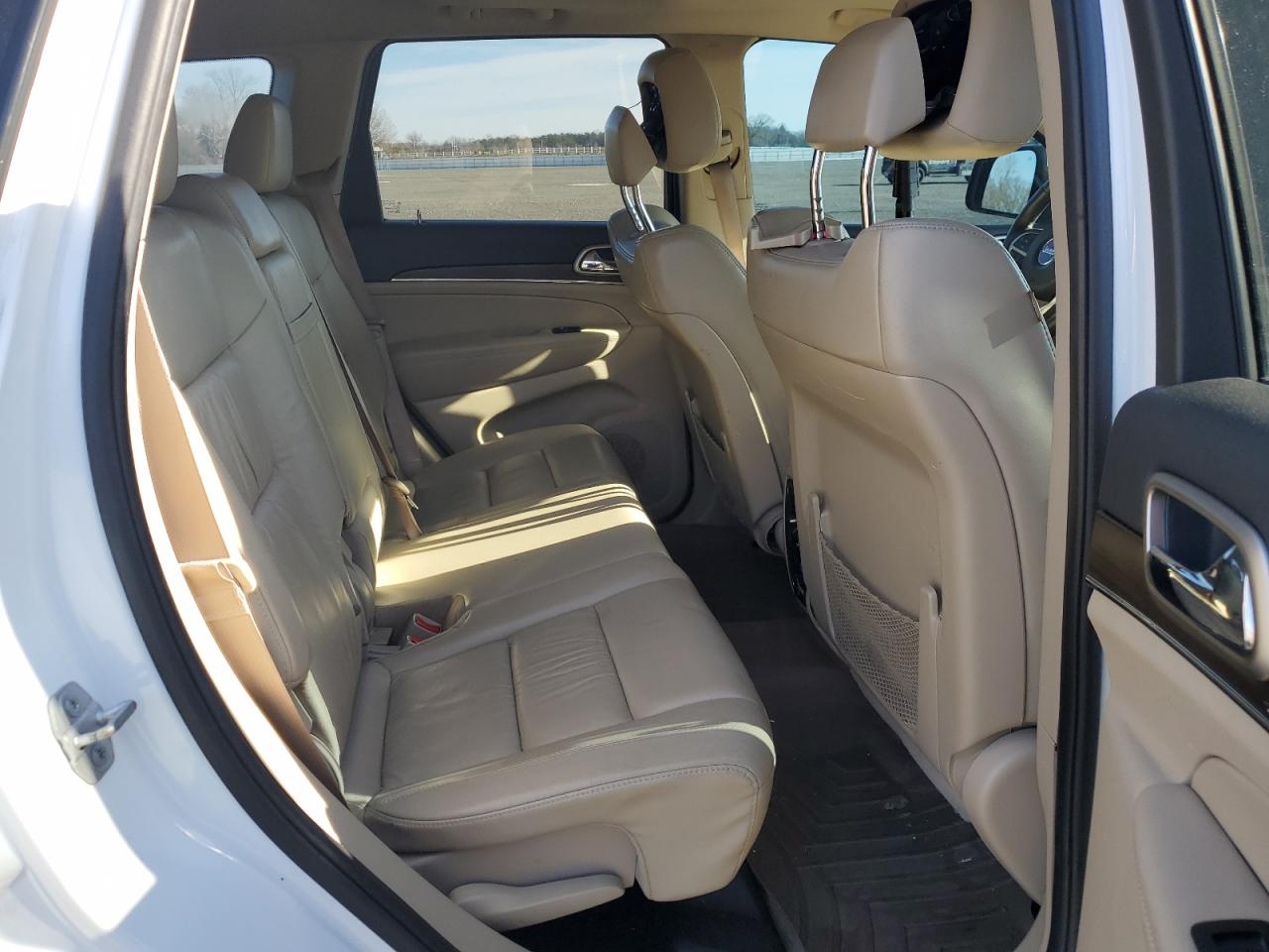 2015 Jeep Grand Cherokee VIN 1C4RJFBG0FC653873 Copart auction photo, rear end damage thumbnail 11