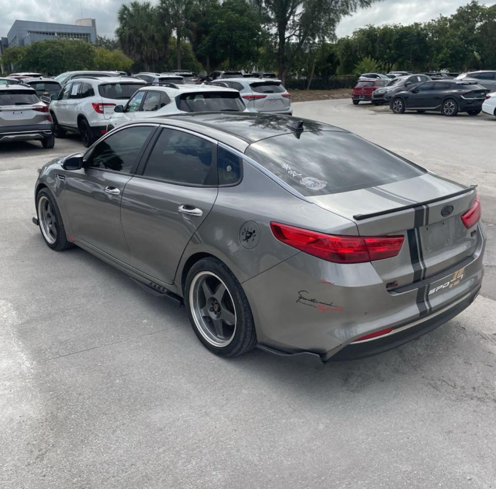 2016 KIA Optima VIN 5XXGU4L3XGG064877 Copart auction photo, minor dent/scratches / normal wear damage thumbnail 3
