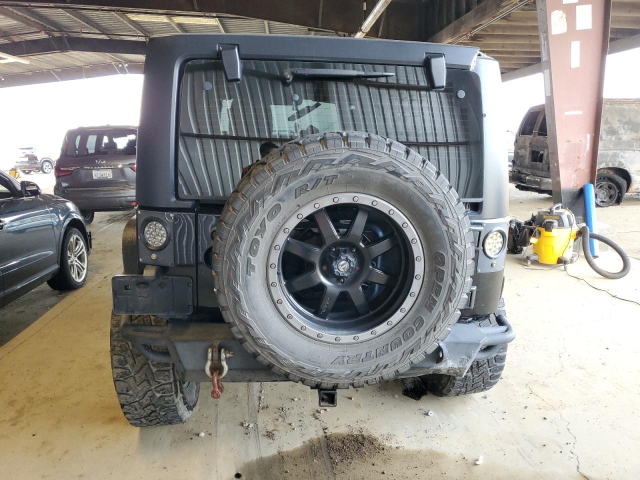 2015 Jeep Wrangler VIN 1C4BJWDG3FL524878 Copart auction photo, all over damage thumbnail 6