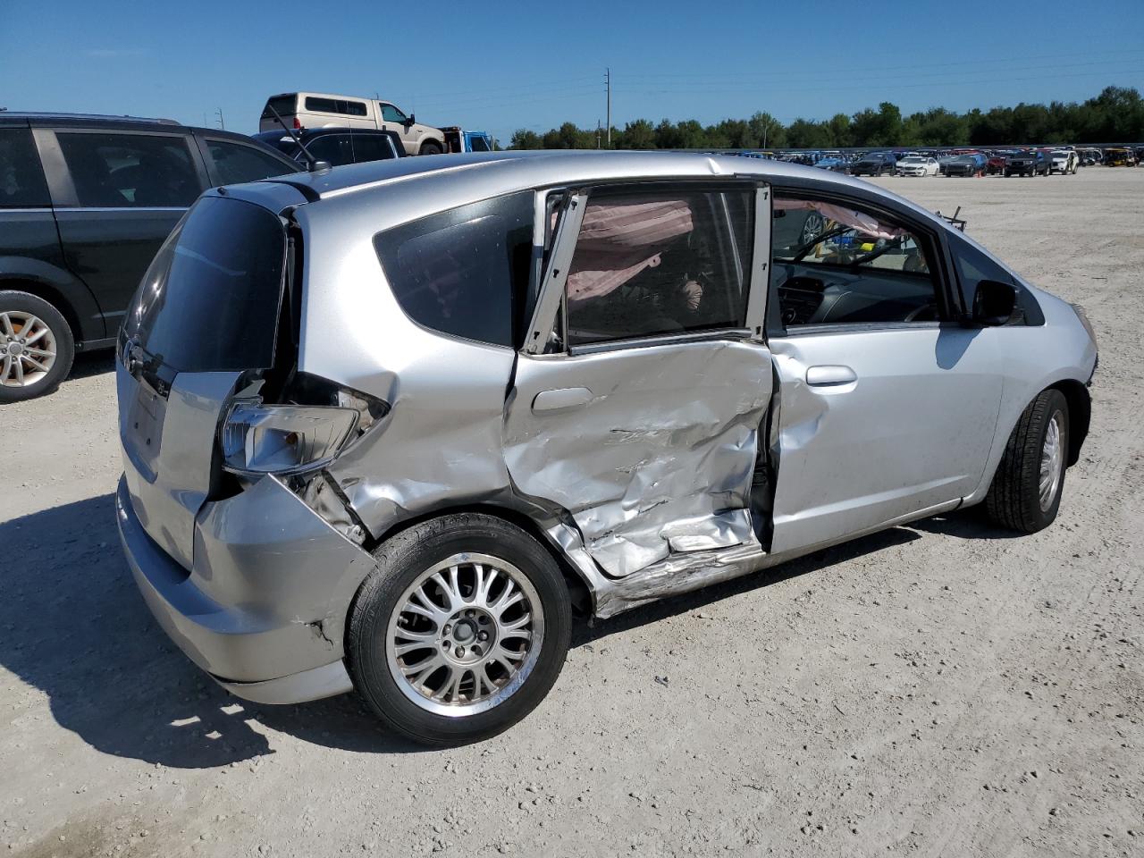 2012 Honda Fit VIN JHMGE8H37CS006009 Copart auction photo, side / front end damage thumbnail 3