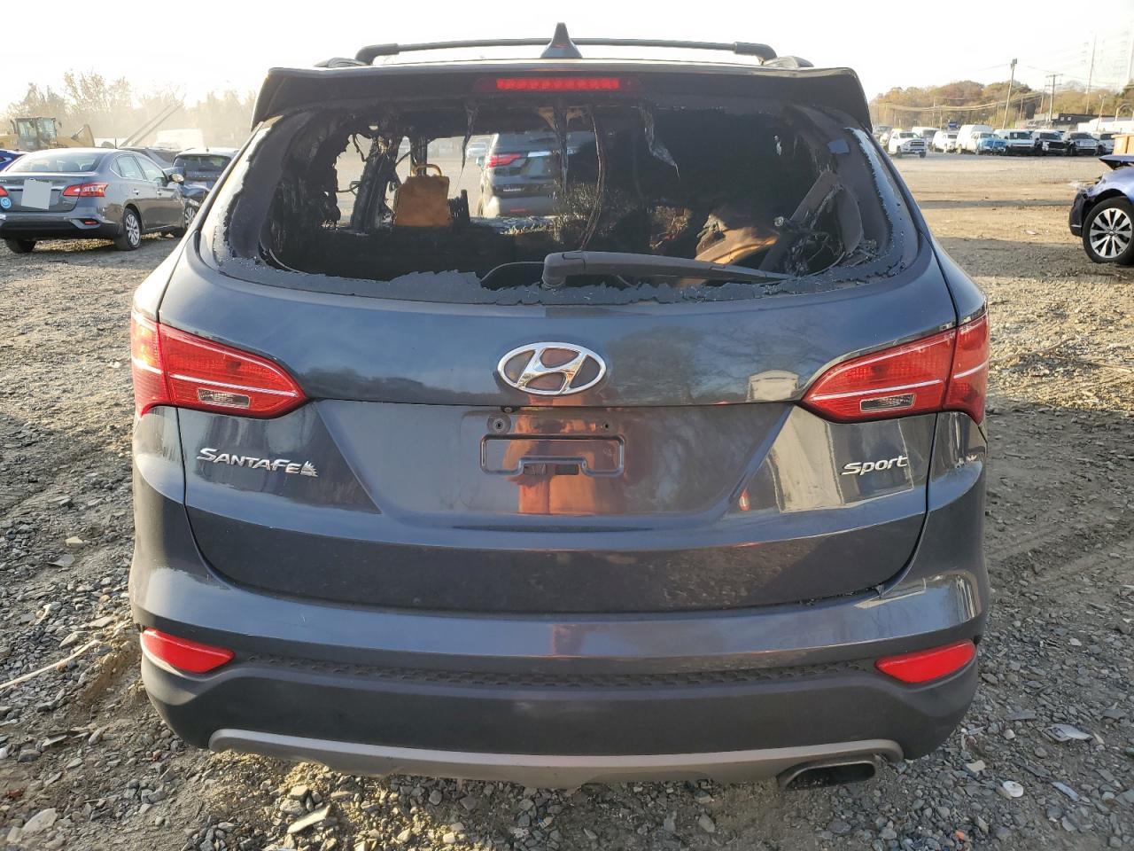 2016 Hyundai Santa Fe VIN 5XYZU3LB3GG346056 Copart auction photo, burn - engine damage thumbnail 6