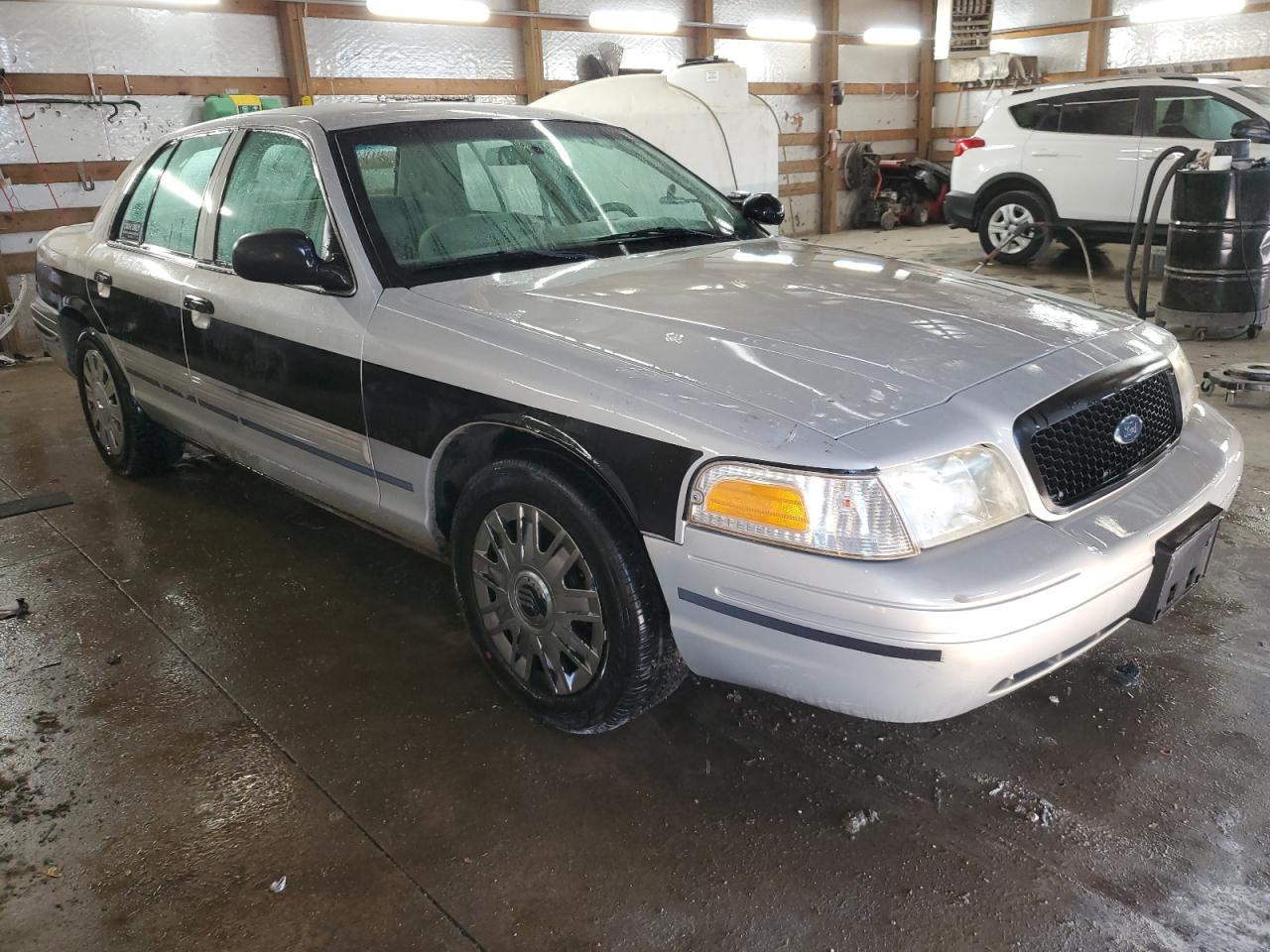 2011 Ford Crown Victoria VIN 2FABP7BV4BX125664 Copart auction photo, side / minor dent/scratches damage thumbnail 4