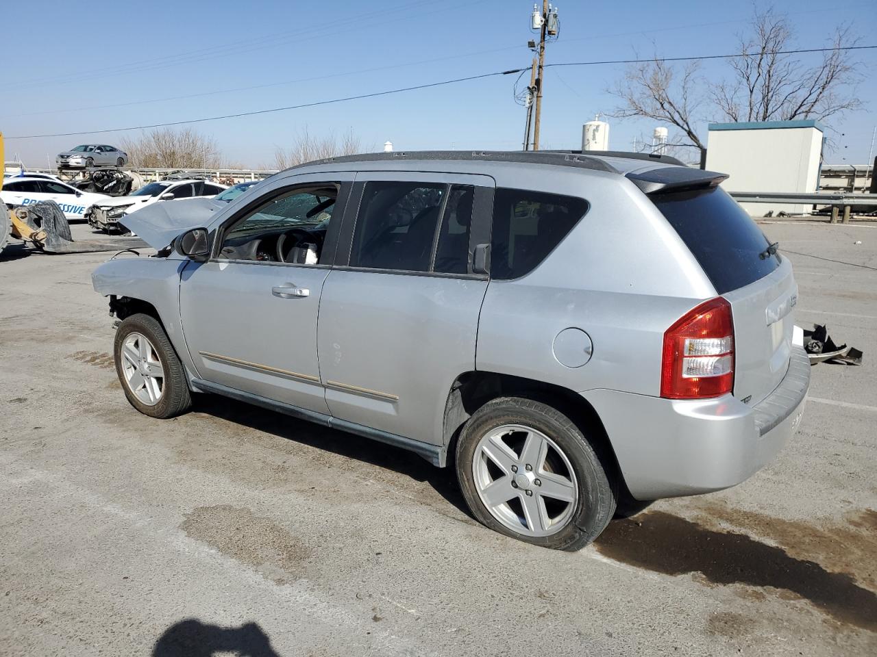 2010 Jeep Compass VIN 1J4NT4FB7AD549325 Copart auction photo, front end / top/roof damage thumbnail 2