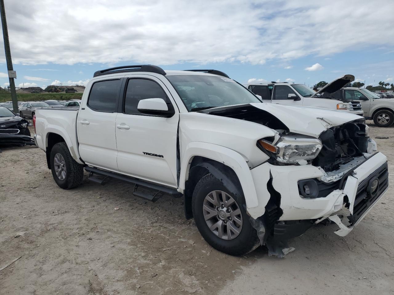 2019 Toyota Tacoma VIN 3TMAZ5CN9KM110771 Copart auction photo, front end / minor dent/scratches damage thumbnail 4
