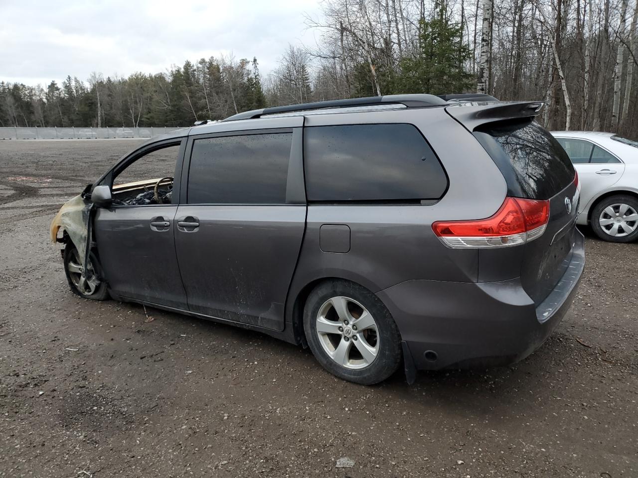 2012 Toyota Sienna VIN 5TDKK3DC1CS217003 Copart auction photo, burn damage thumbnail 2