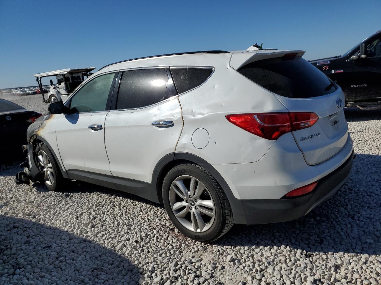 2014 Hyundai Santa Fe VIN 5XYZU3LA2EG184960 Copart auction photo, burn damage thumbnail 2