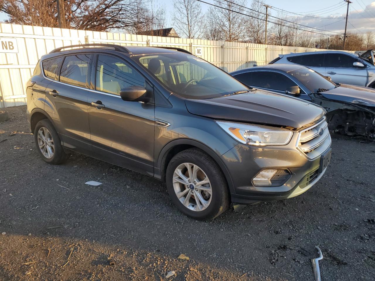 2018 Ford Escape VIN 1FMCU9GD5JUA99256 Copart auction photo, front end / minor dent/scratches damage thumbnail 4