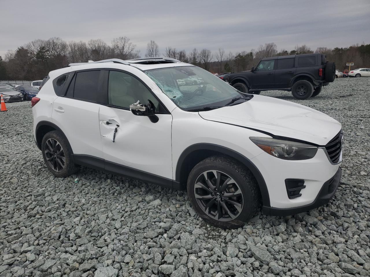 2016 Mazda CX-5 VIN JM3KE4DY3G0796990 Copart auction photo, all over damage thumbnail 4