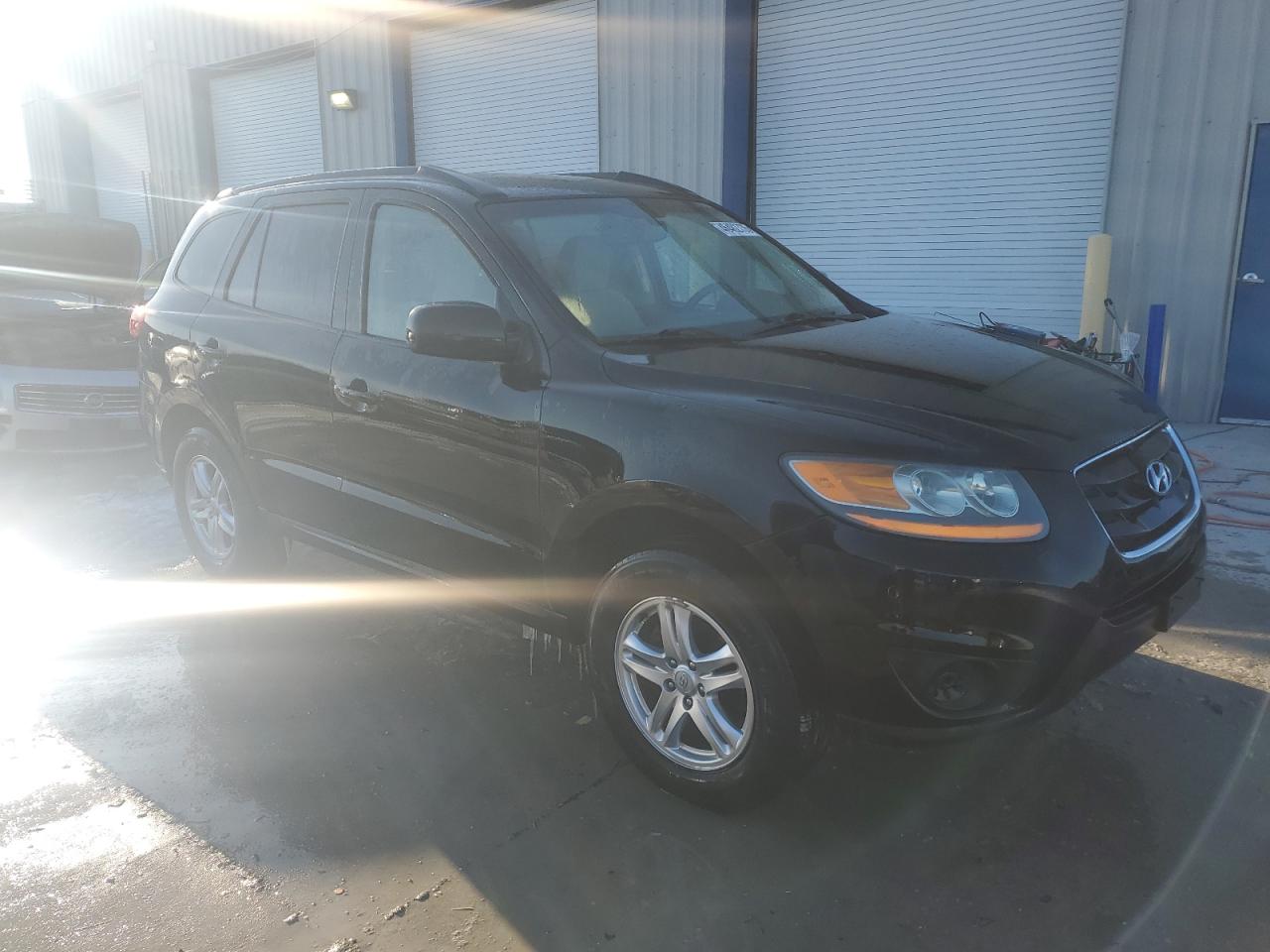 2011 Hyundai Santa Fe VIN 5XYZGDAB3BG087335 Copart auction photo, side / front end damage thumbnail 4