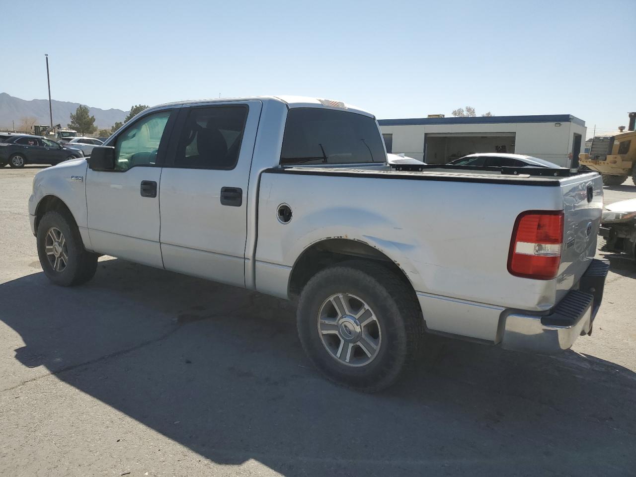 2005 Ford F-150 VIN 1FTPW12505FB57804 Copart auction photo, rear end / minor dent/scratches damage thumbnail 2