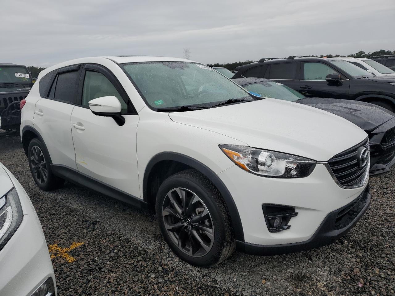 2016 Mazda CX-5 VIN JM3KE2DY6G0784515 Copart auction photo, water/flood damage thumbnail 4