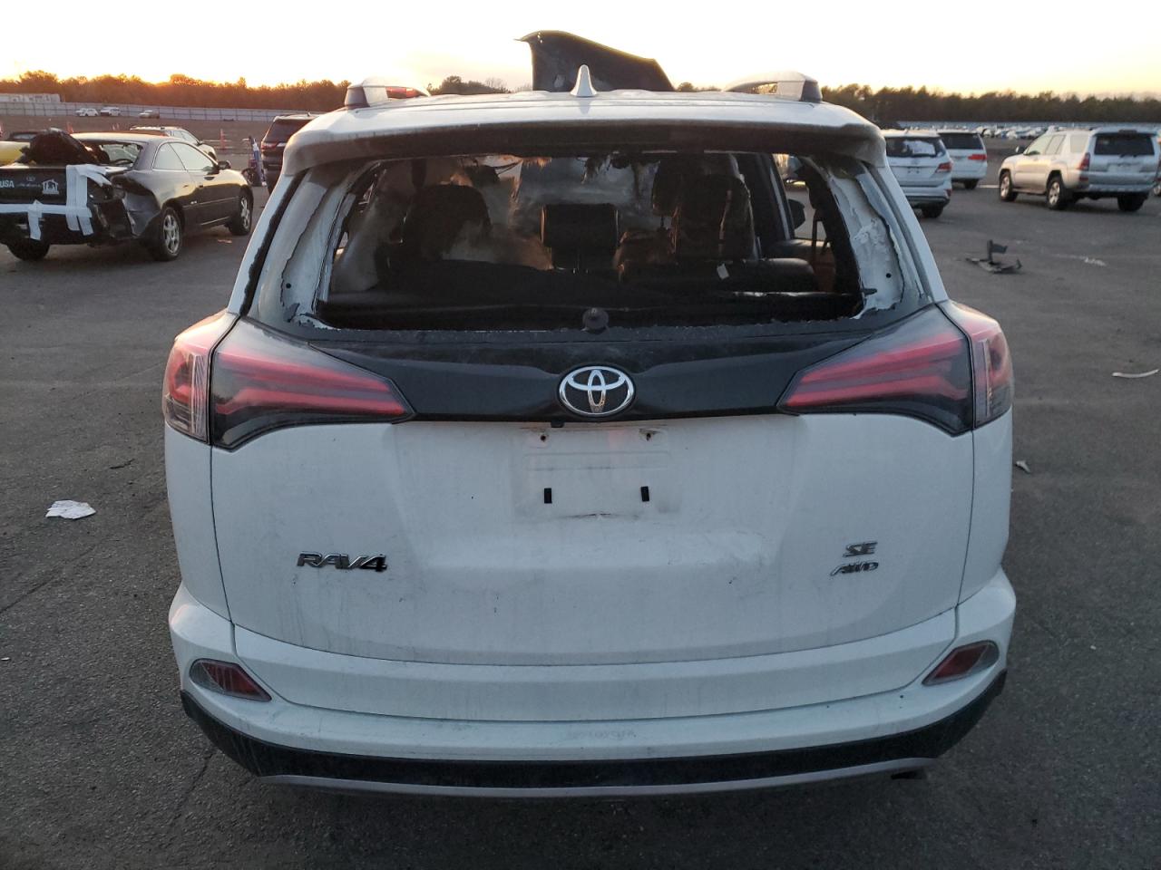 2018 Toyota RAV 4 VIN JTMJFREV6JJ233517 Copart auction photo, burn - engine / burn - interior damage thumbnail 6