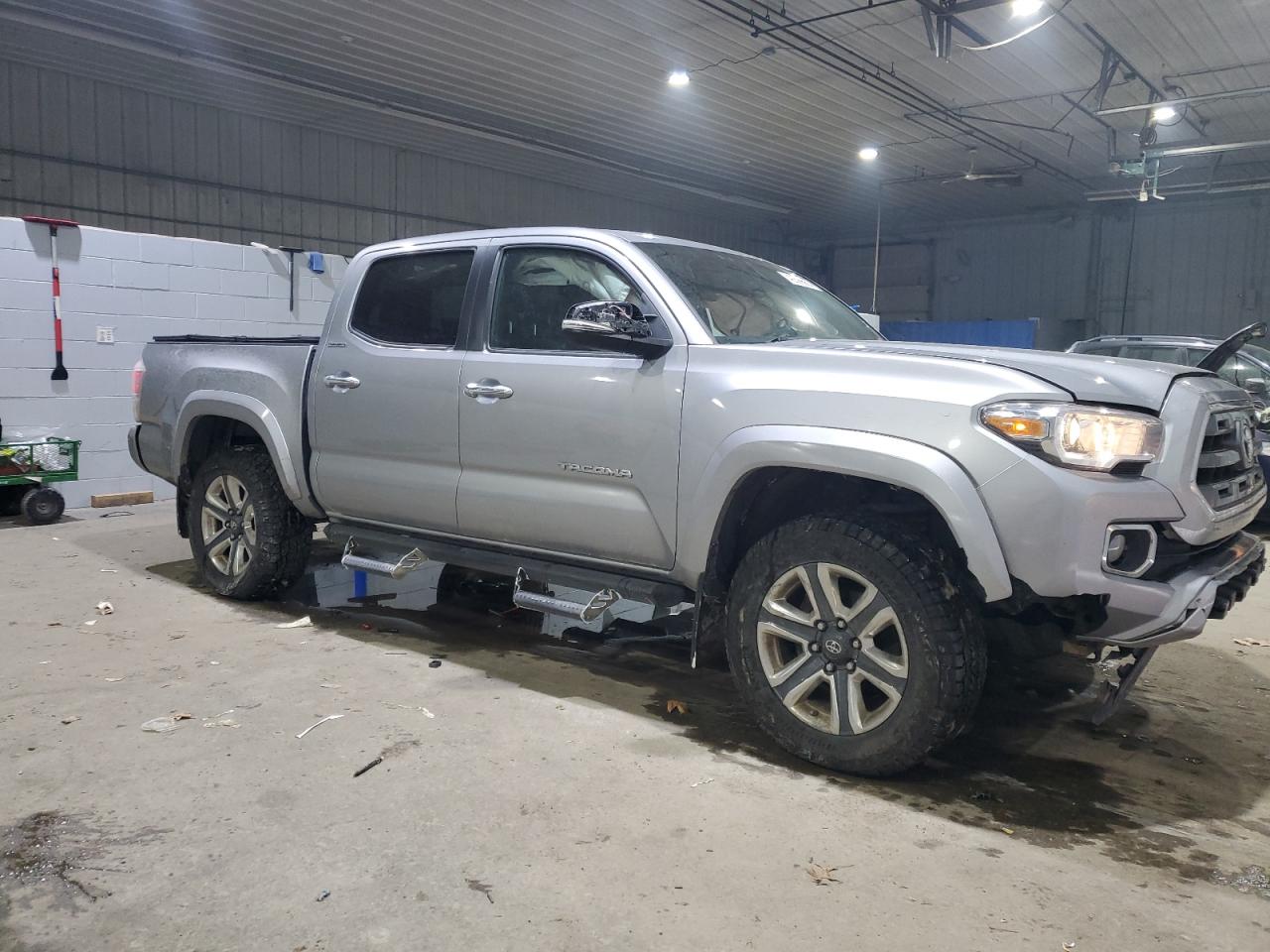 2016 Toyota Tacoma VIN 3TMGZ5AN6GM016464 Copart auction photo, side / front end damage thumbnail 4