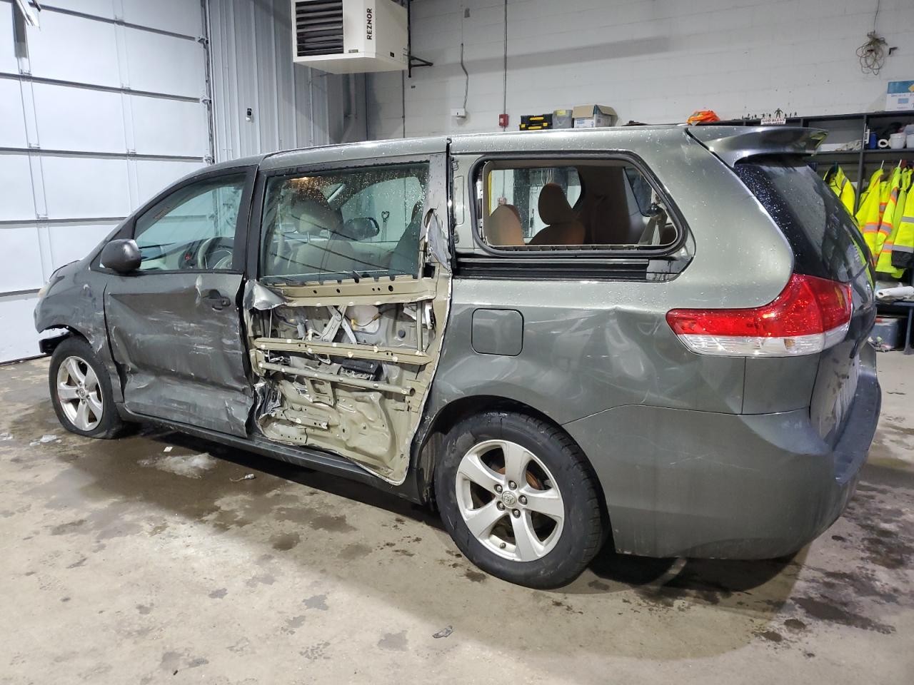 2012 Toyota Sienna VIN 5TDKA3DC0CS010900 Copart auction photo, side / front end damage thumbnail 2