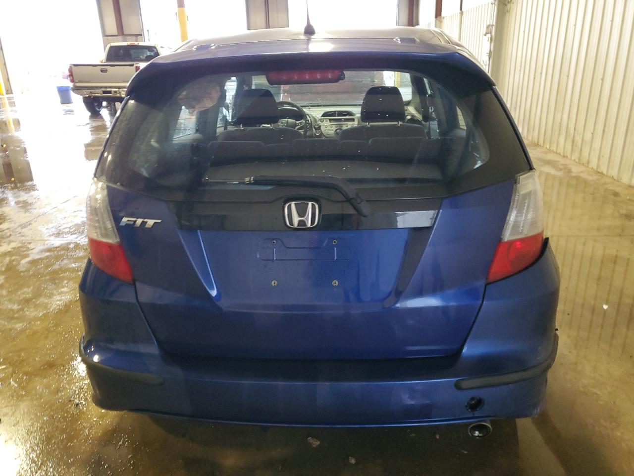 2009 Honda Fit VIN JHMGE88479S031302 Copart auction photo, side / rear end damage thumbnail 6