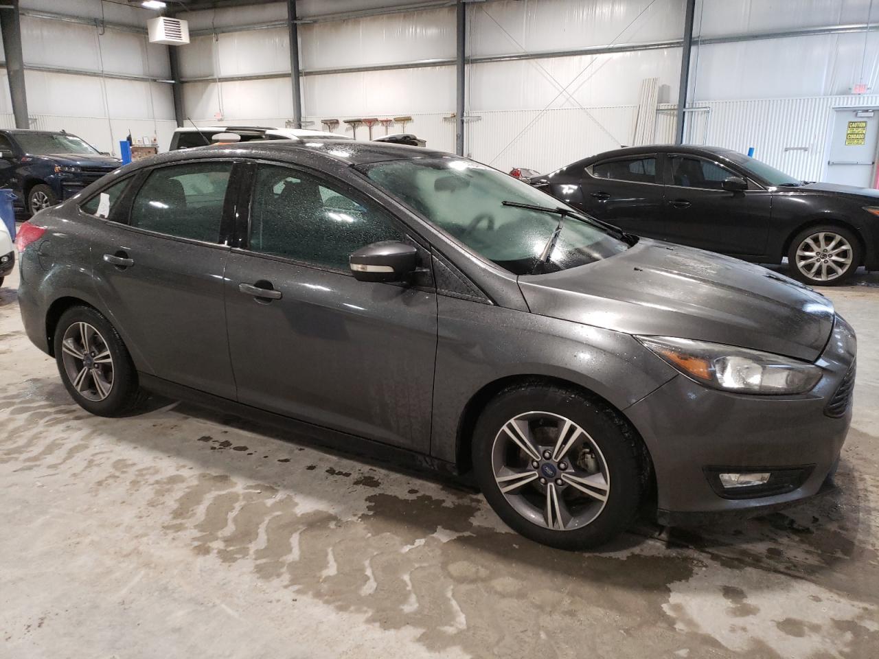 2017 Ford Focus VIN 1FADP3FE5HL319346 Copart auction photo, burn - engine damage thumbnail 4
