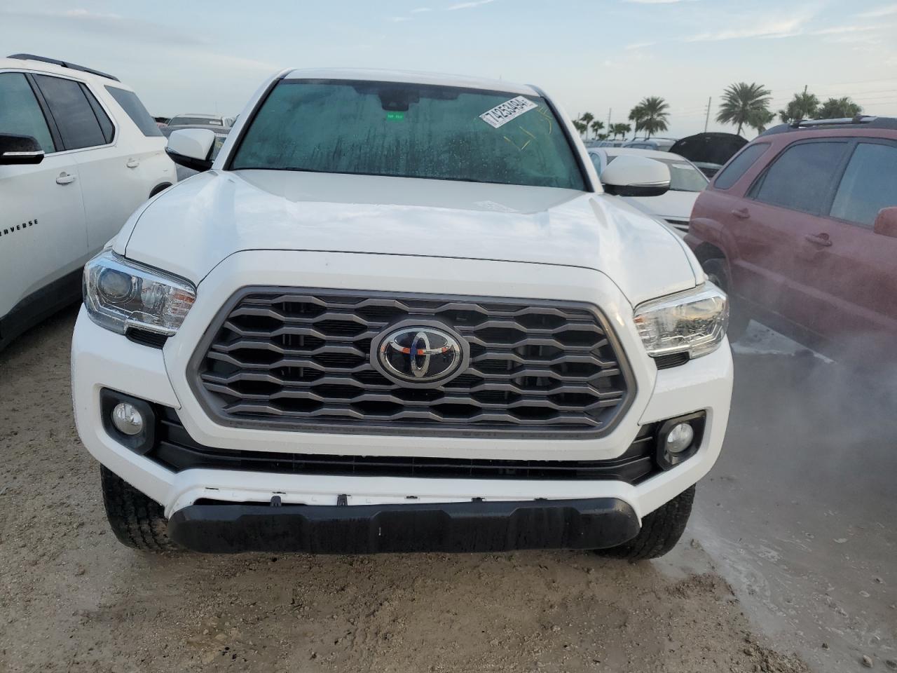 2021 Toyota Tacoma VIN 3TYCZ5AN4MT037005 Copart auction photo, water/flood damage thumbnail 5