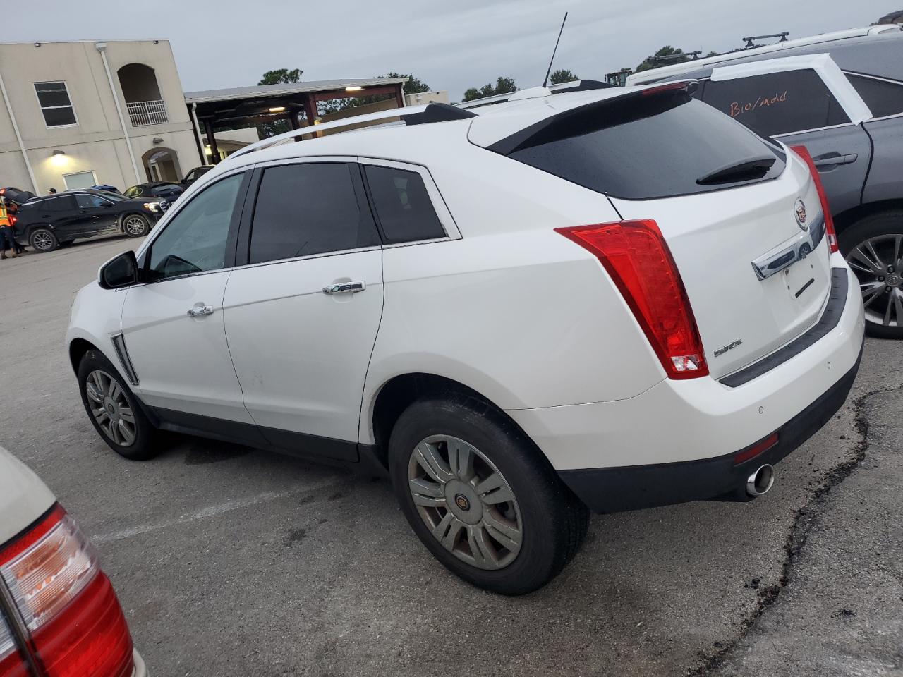 2015 Cadillac SRX VIN 3GYFNBE34FS550422 Copart auction photo, water/flood damage thumbnail 2