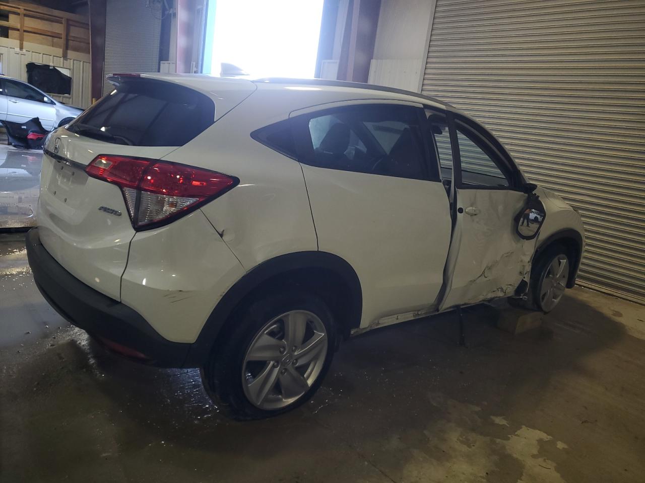 2019 Honda HR-V VIN 3CZRU6H58KM708327 Copart auction photo, side / undercarriage damage thumbnail 3