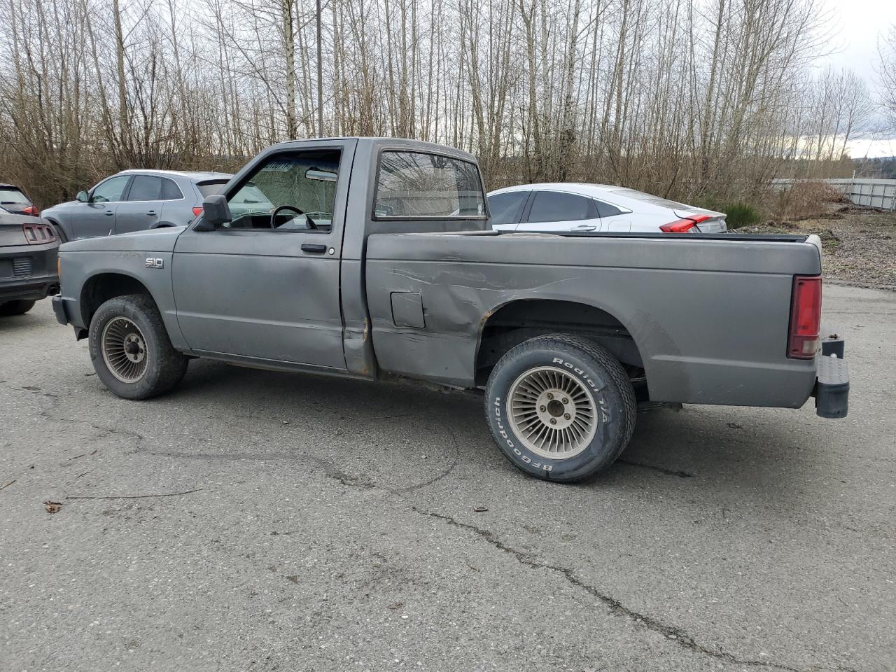 1988 Chevrolet S-10 Pickup VIN 1GCBS14E1J2210255 Copart auction photo, side damage thumbnail 2