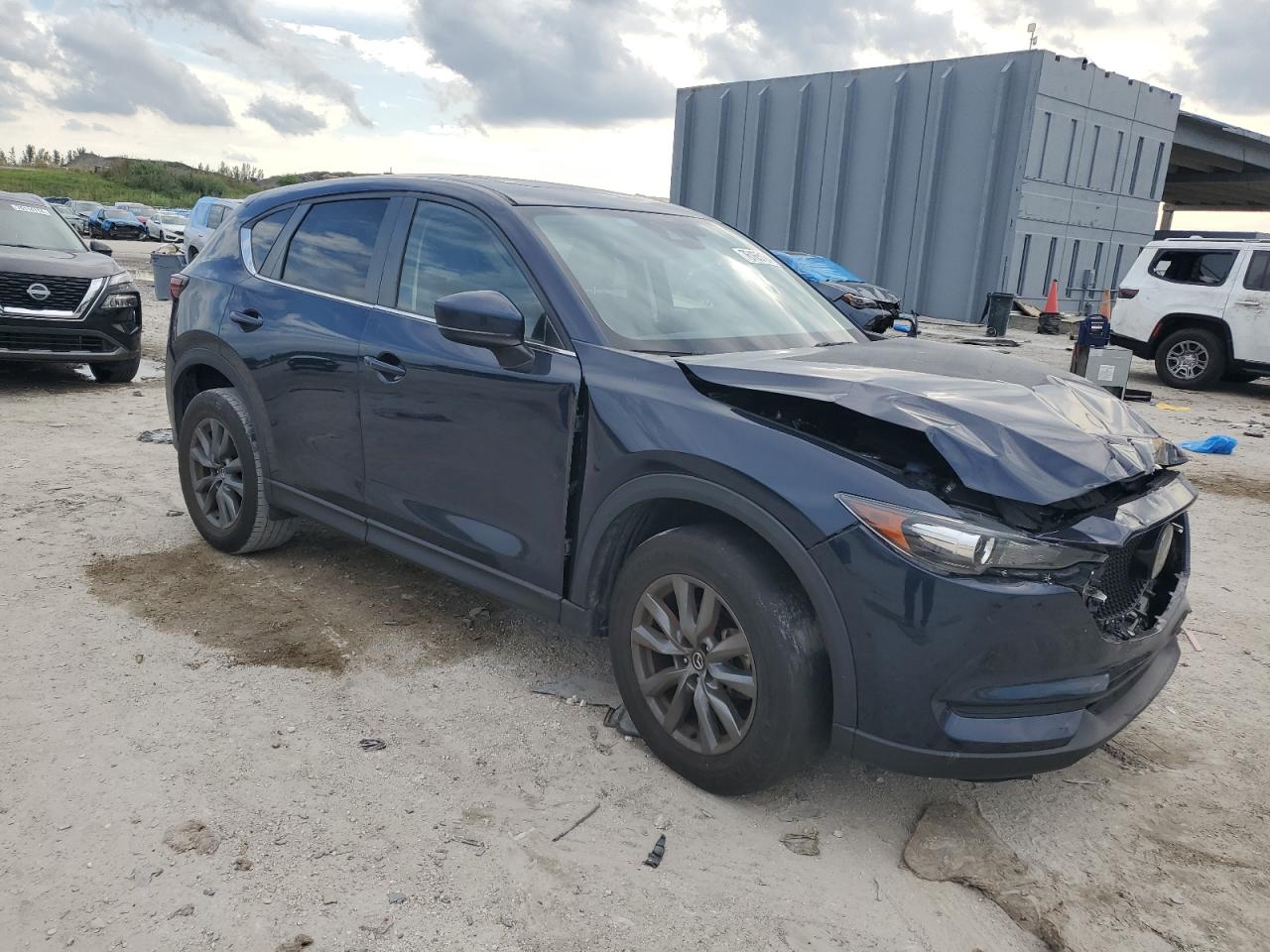 2021 Mazda CX-5 VIN JM3KFACM8M0415494 Copart auction photo, front end / minor dent/scratches damage thumbnail 4