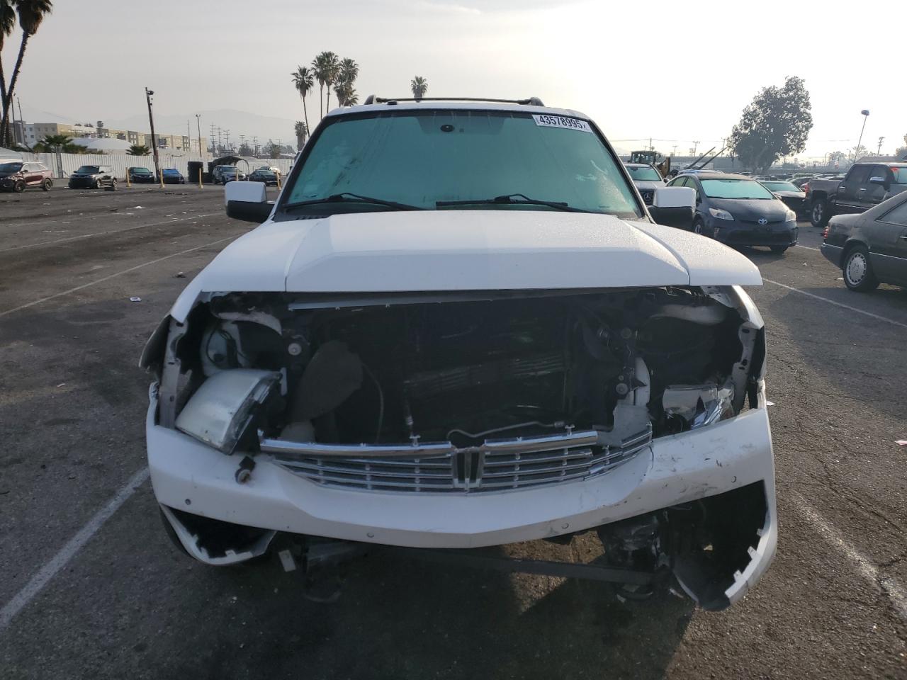 2014 Lincoln Navigator VIN 5LMJJ2H53EEL05069 Copart auction photo, front end / minor dent/scratches damage thumbnail 5